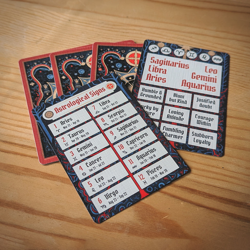 Set of astrological sign cards on a wooden surface